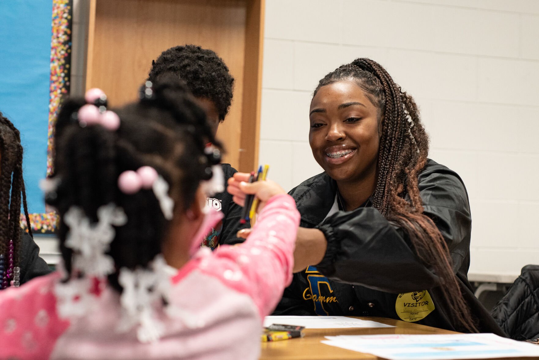 UNIDOS volunteers has fun creating crafts with students